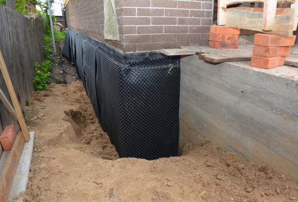 Happy homeowners after waterproofing job in Bon Secour